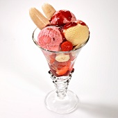 A strawberry and banana ice cream sundae