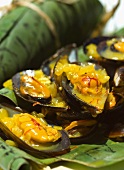 Mussels with saffron and white wine sauce, served in banana leaves