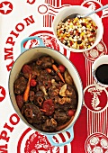 Oxtail stew with a flaked corn and vegetable salad (South Africa)