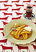 Baked bananas with caramel sauce and cream
