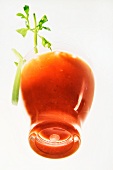 A glass of Bloody Mary with celery