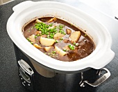 Beef Stew with Peas and Potatoes in a Slow Cooker