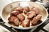 Browning Chunks of Beef in a Skillet for Beef Stew
