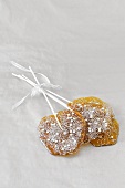 Two home-made lollies with silver glitter, as gifts