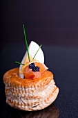 A vol-au-vent filled with egg, smoked salmon and lumpfish caviar