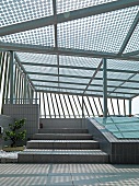 Rooftop deck covered with glass canopy