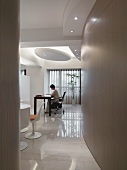 Woman working at desk in modern home