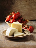 Bowls of cheeses and tomatoes