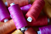 Close up of colorful spools of thread