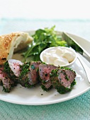 Roast beef with a herb crust, salad and bread