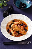 Chicken legs with olives in tomato sauce