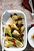 Baked fennel with dried tomatoes and olives