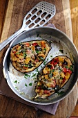 Aubergines filled with peppers, courgettes and croutons (seen from above)