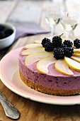 Blackberry and cream cheese cake topped with blackberries and pears