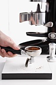 A barrista preparing espresso