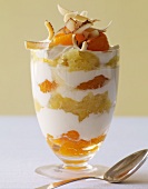 Layered Fruit and Cream Dessert Topped with Toasted Coconut