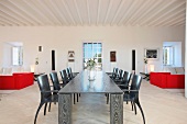 Black dining table in modern white interior