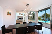 Black dining room table in modern dining room