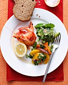Plate of prawns with salads and bread