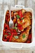 Chicken legs with peppers and tomatoes