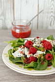 Spinach salad with raspberries and gorgonzola cheese