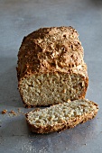 A loaf of wholemeal bread, sliced