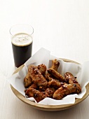 Bowl of Chicken Wings with a Glass of Beer
