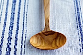 Wooden Ladle on a Blue and White Tablecloth