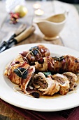 Turkey breast filled with sausage and chestnut puree wrapped in pancetta and sage leaves