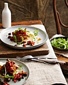 Plates of chicken with chorizo and salad