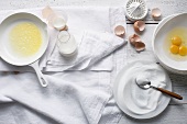 Sugar, butter, eggs and milk on table