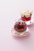 Glass of berry jam with cream