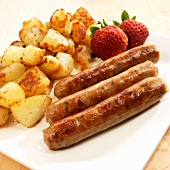 Three Breakfast Sausages with Homefries and Strawberries