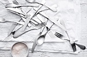 Silverware and flour on table