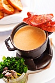 A fondue made with gouda and porter cheese with Andouille sausage, broccolini and asparagus