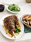 Plate of lamb with lemons and potatoes