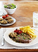 Beef steak with capers, gherkins and chips