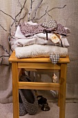 Stack of clothes on wooden stool
