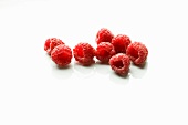 Eight Fresh Raspberries on White Background