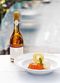 Jelly with ice cream and sliced apple and a bottle of Tokaji wine