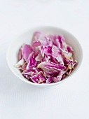A bowl of dried rose petals