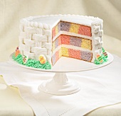 Battenburg cake decorated with white fondant icing for Easter