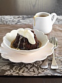 Chocolate and date pudding with caramel sauce and cream