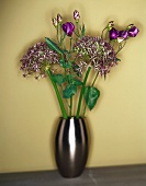 Bouquet of chive flowers in silver vase