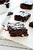 Glazed brownies with pecan nuts and orange