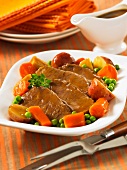 Roast beef with gravy and vegetables