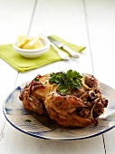 Rotisserie chicken stuffed with couscous, nuts and parsley