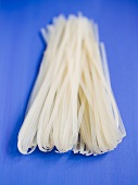 Rice noodles on a blue surface