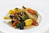 Fennel wrapped in foil cooked with olives, tomatoes and potatoes