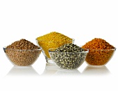 Various legumes in glass bowls